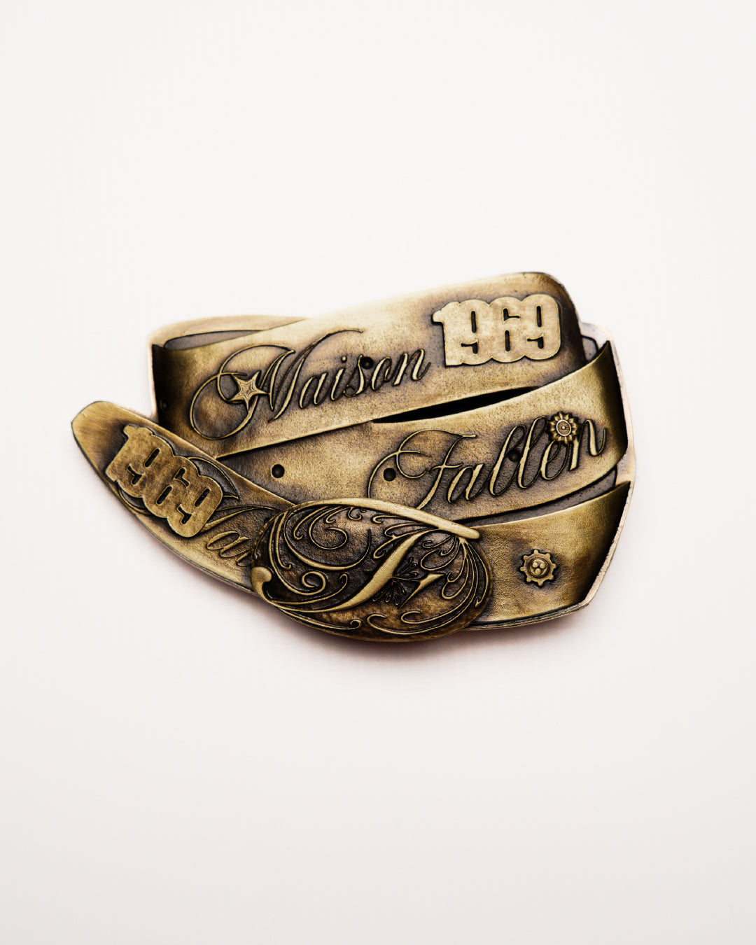 Bronze belt with intricate designs and text on a white background