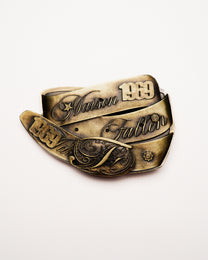 Bronze belt with intricate designs and text on a white background