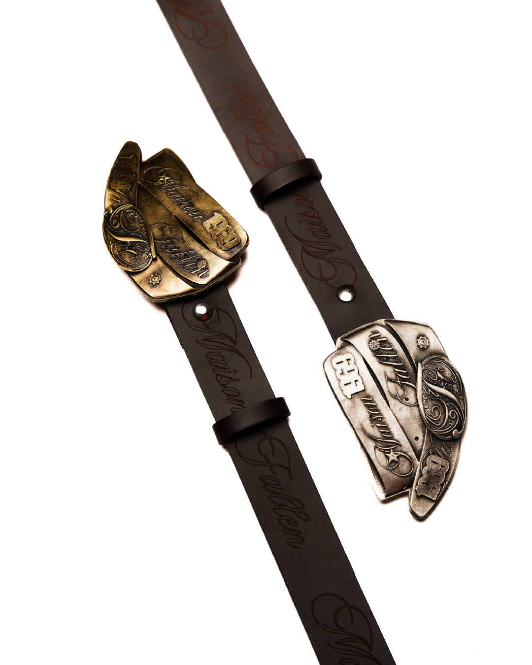 Brown leather belt with ornate gold buckle on a white background