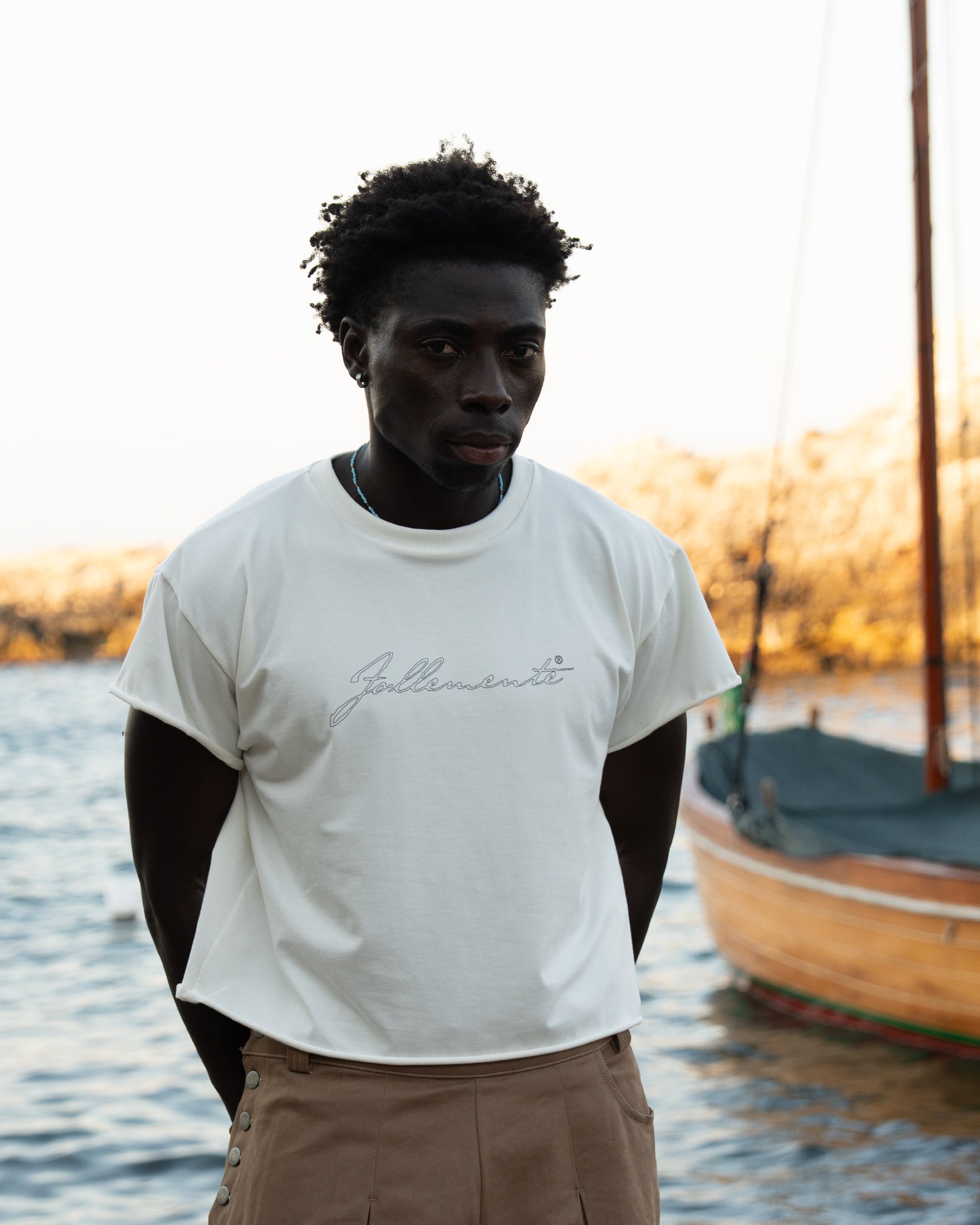 “follemente”  organic cotton baby tee white — Patwa SS26